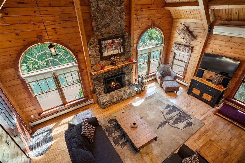 67 Streeter Road Sturbridge, MA 01518 - Photo 11 of 41 an aerial view of a fireplace with wooden floor