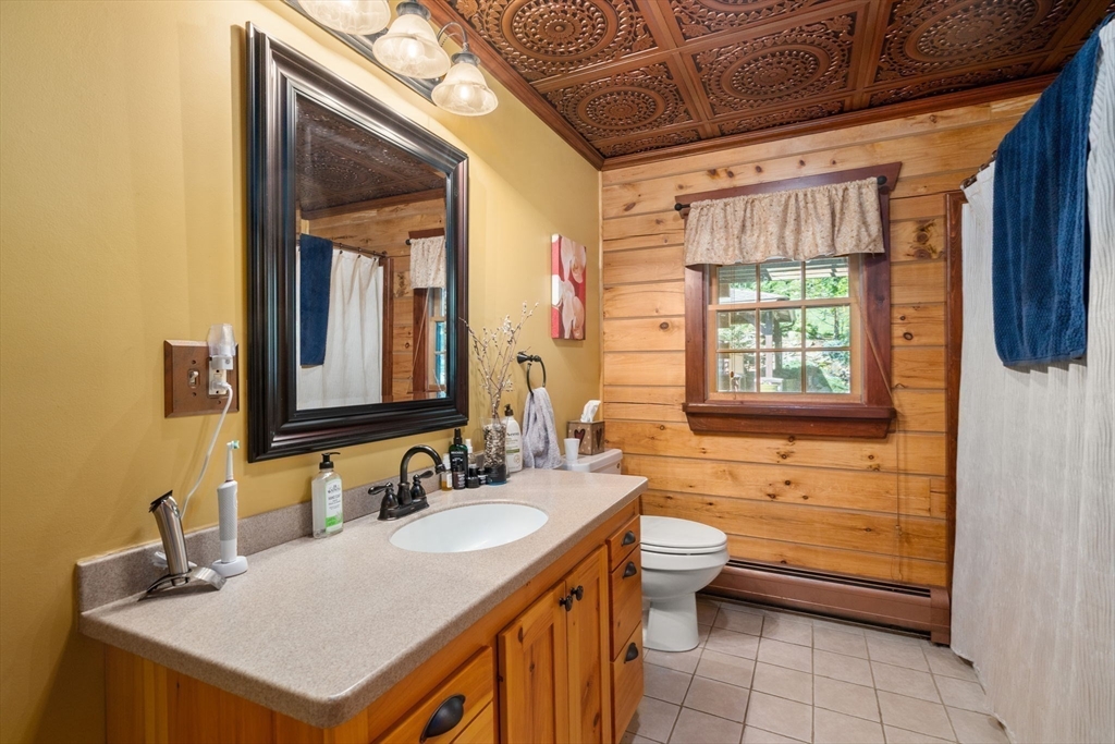67 Streeter Road Sturbridge, MA 01518 - Photo 25 of 41 a bathroom with a sink and a mirror