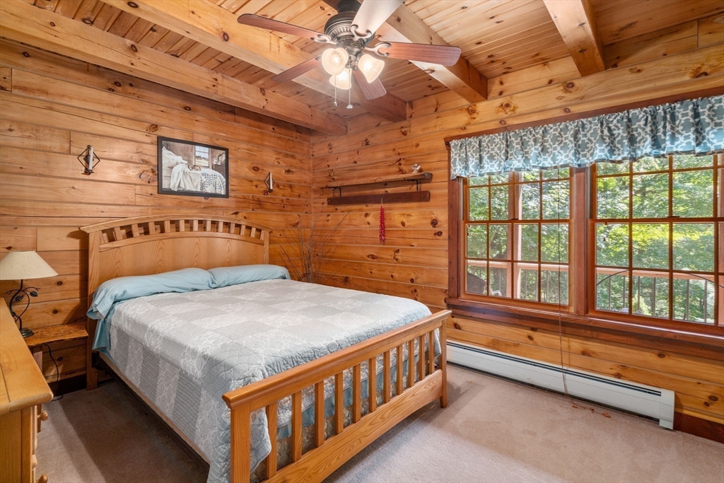 67 Streeter Road Sturbridge, MA 01518 - Photo 26 of 41 a bedroom with a bed and a large window
