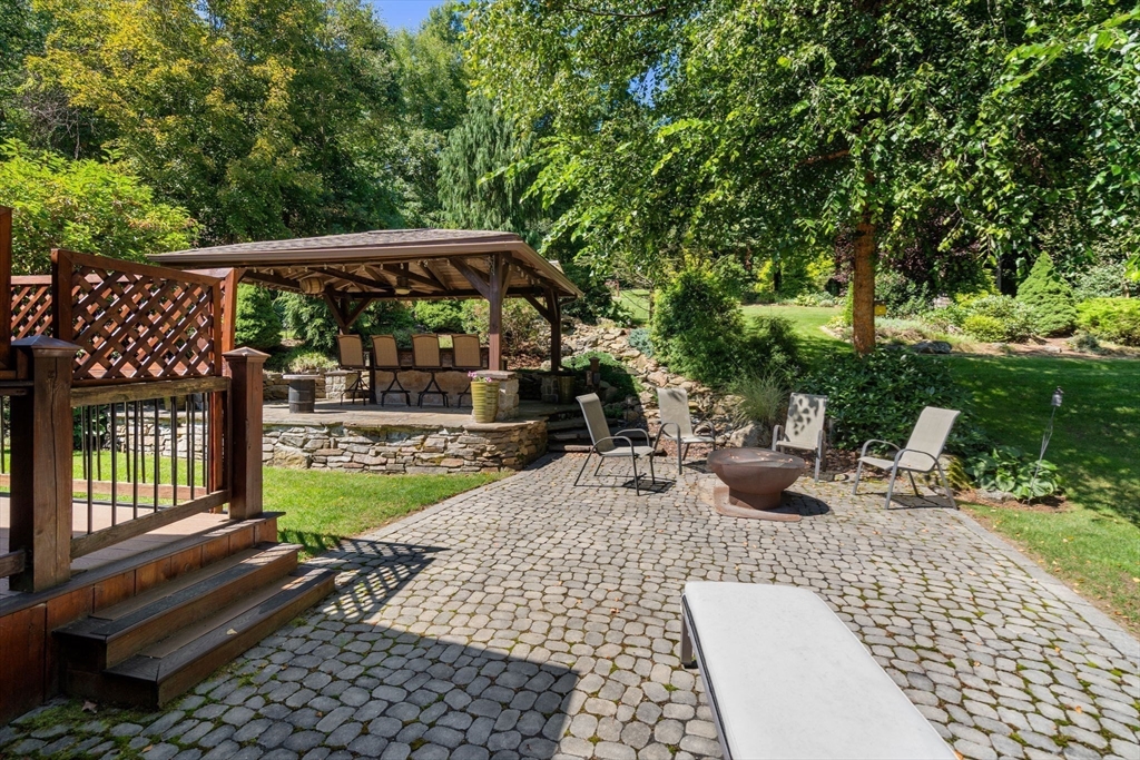 67 Streeter Road Sturbridge, MA 01518 - Photo 3 of 41 a view of a chair and tables the patio in the backyard