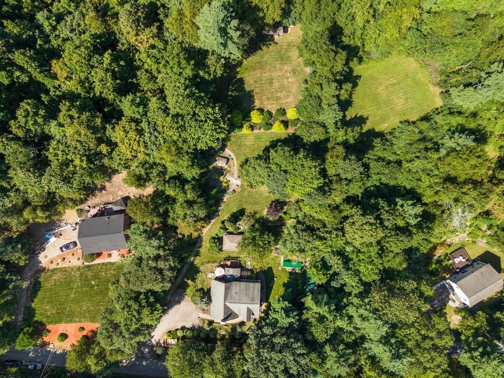 67 Streeter Road Sturbridge, MA 01518 - Photo 37 of 41 an aerial view of residential house with outdoor space and trees all around