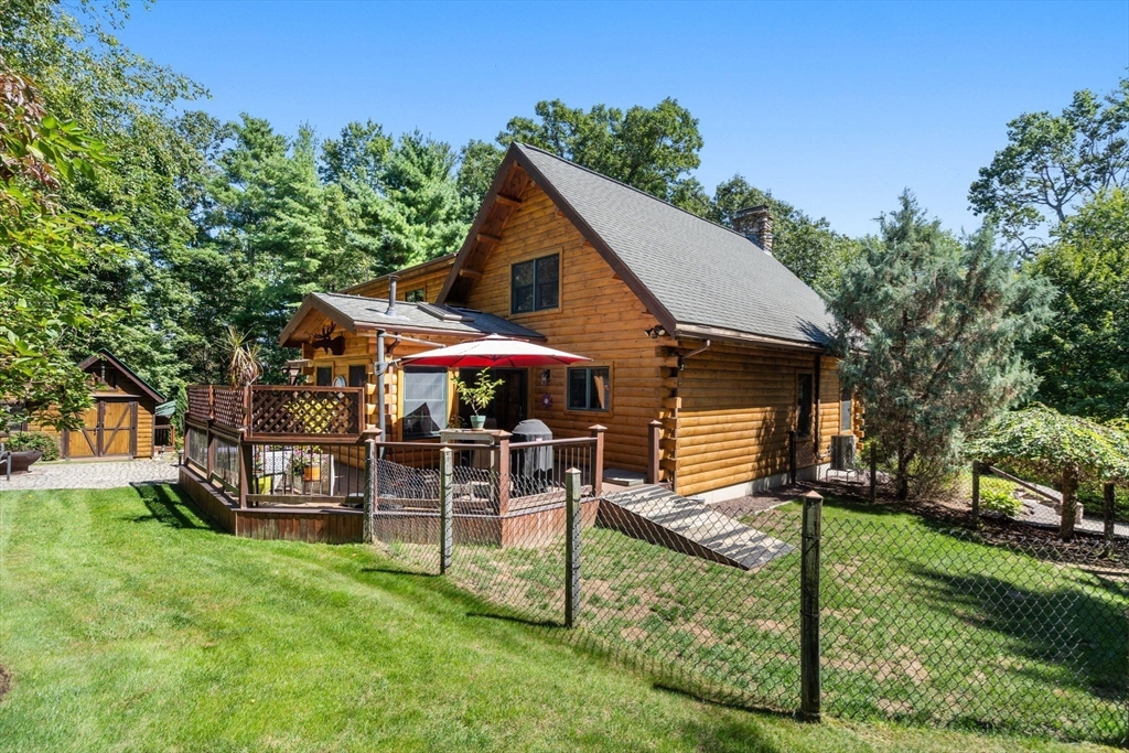 67 Streeter Road Sturbridge, MA 01518 - Photo 5 of 41 a view of a house with a yard porch and sitting area