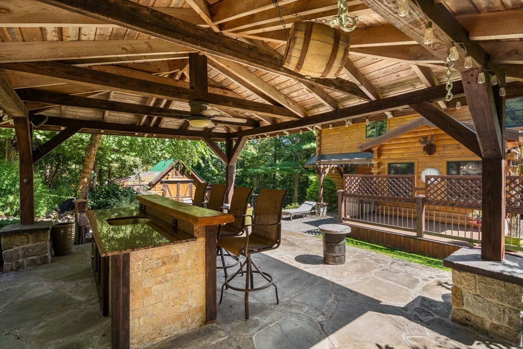 67 Streeter Road Sturbridge, MA 01518 - Photo 6 of 41 a view of a chairs and table in the patio