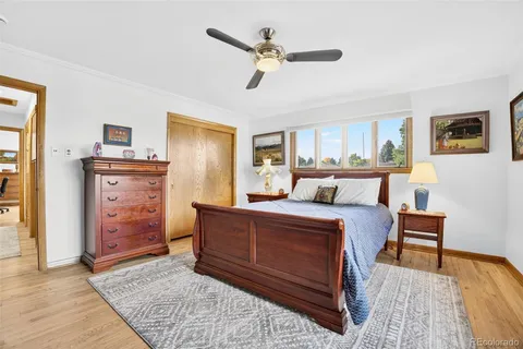 a living room with furniture and a dresser