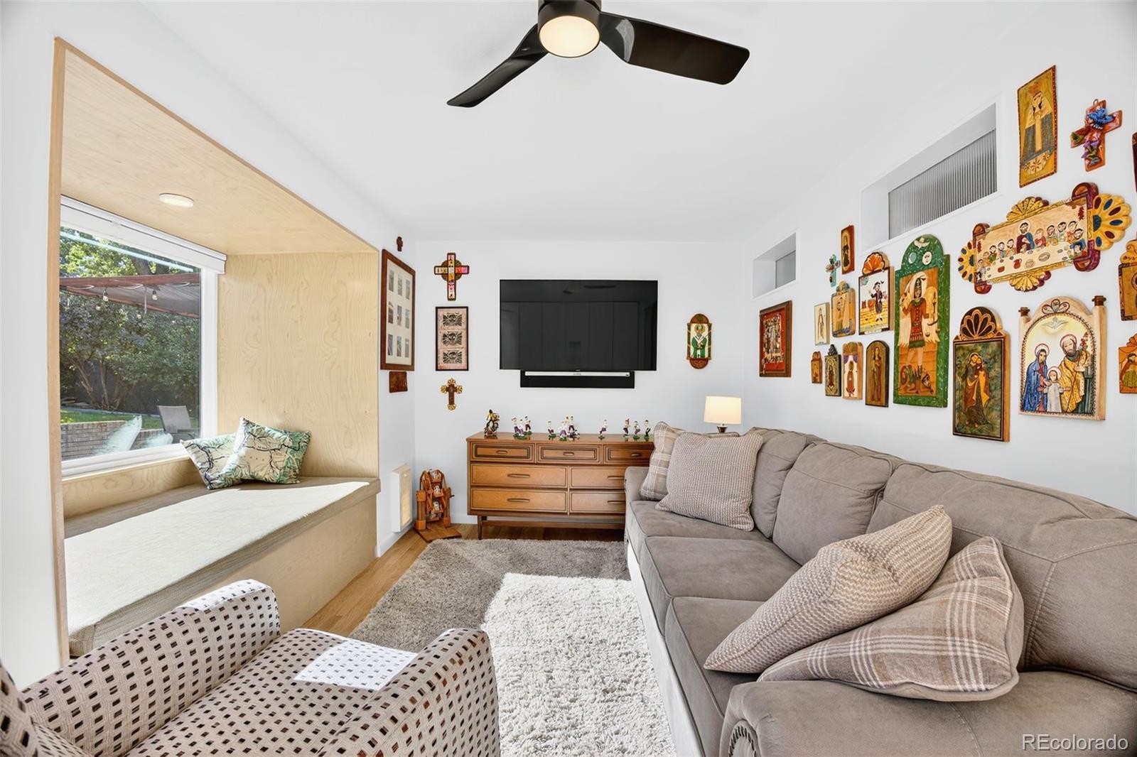 52 Hillside Drive Wheat Ridge, CO 80215 - Photo 23 of 48 a living room with furniture and flat screen tv
