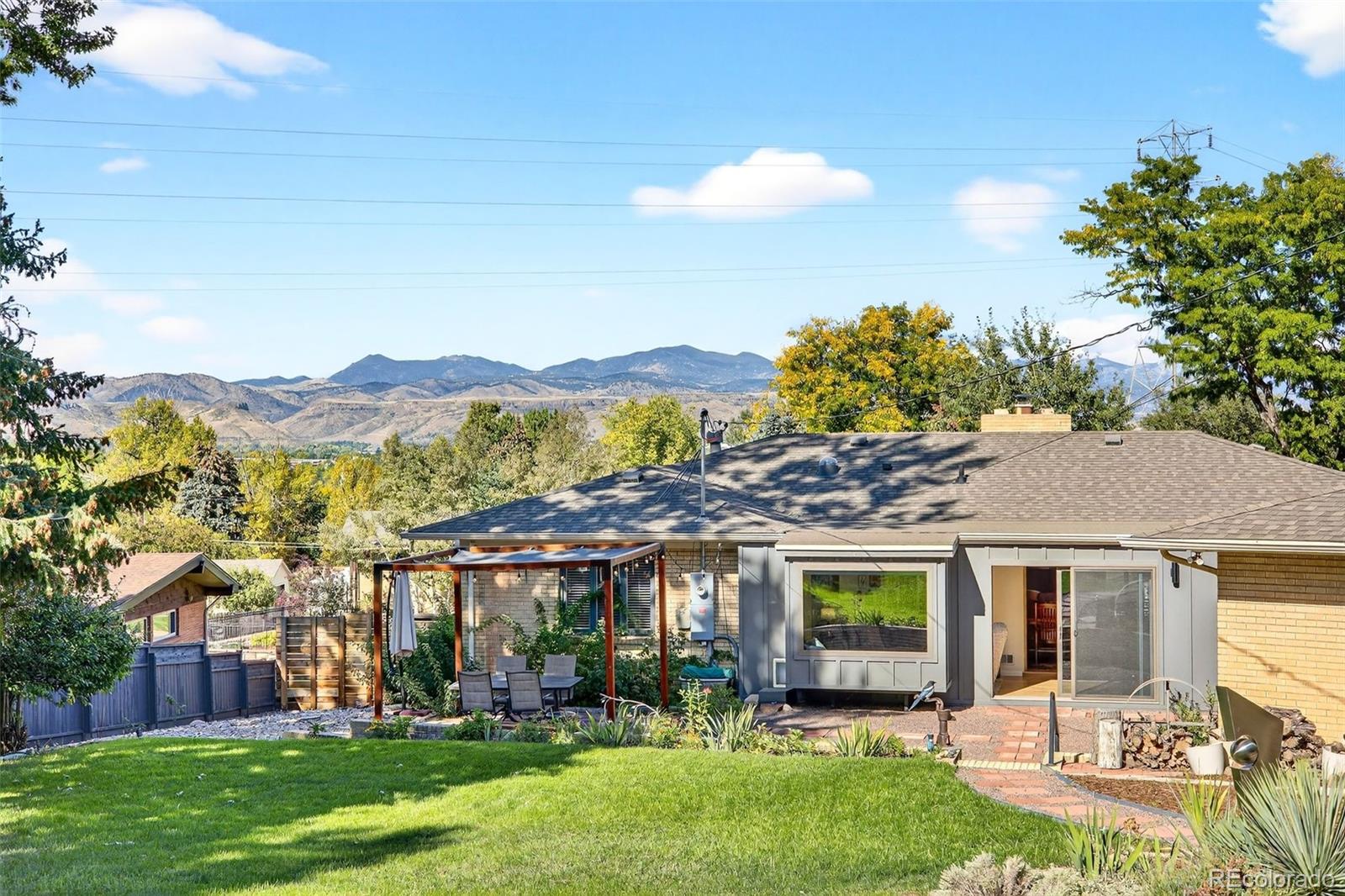52 Hillside Drive Wheat Ridge, CO 80215 - Photo 36 of 48 a view of a house with a garden