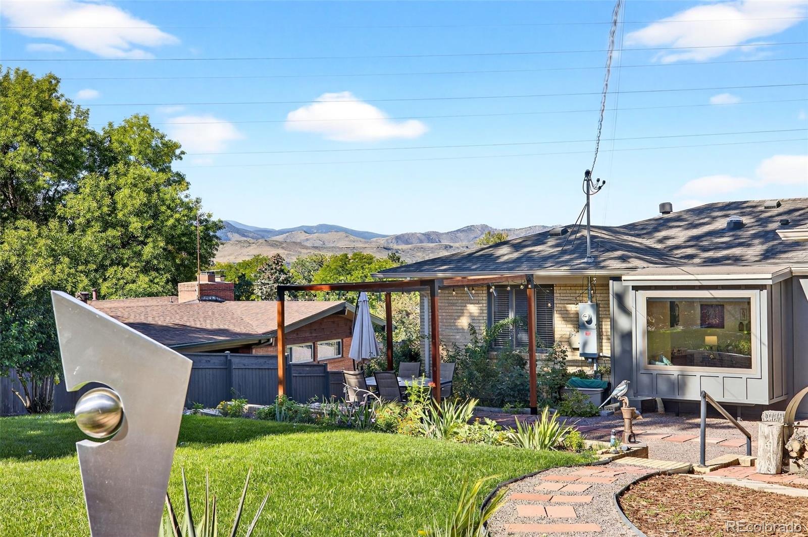 52 Hillside Drive Wheat Ridge, CO 80215 - Photo 37 of 48 a front view of a house with garden