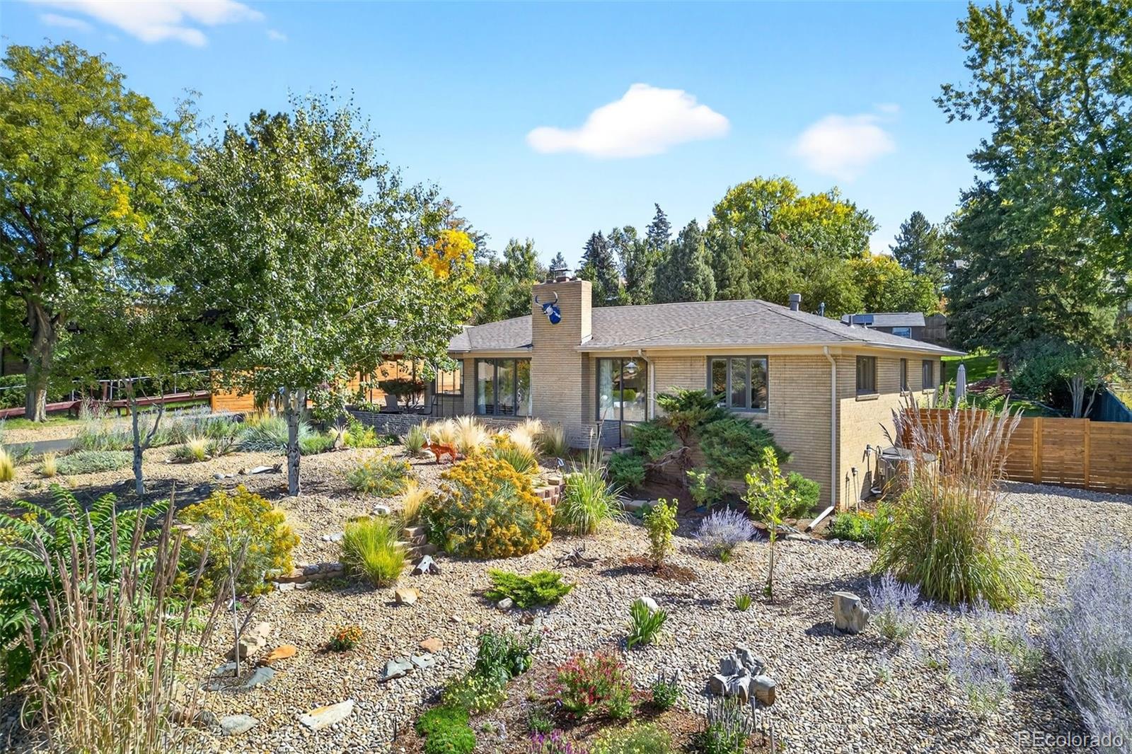 52 Hillside Drive Wheat Ridge, CO 80215 - Photo 40 of 48 a front view of a house with a yard