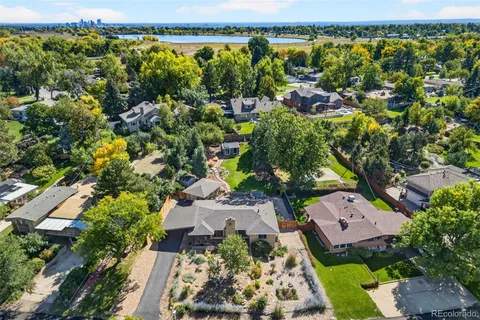 an aerial view of residential house with outdoor space and swimming pool