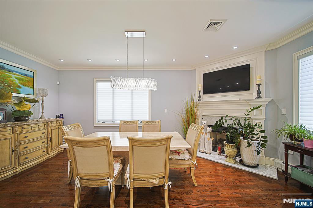 897 Virgil Avenue Ridgefield, NJ 07657 - Photo 25 of 50 a view of a dining room with furniture window and wooden floor