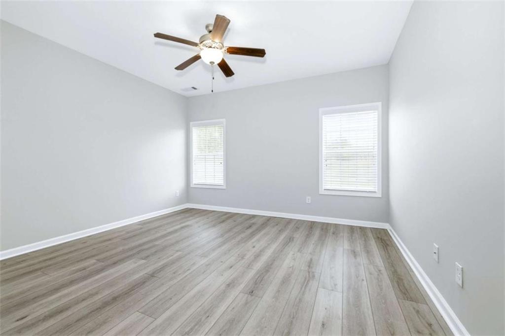 2066 Highway 63 Homer, GA 30547 - Photo 20 of 65 wooden floor in an empty room with a window