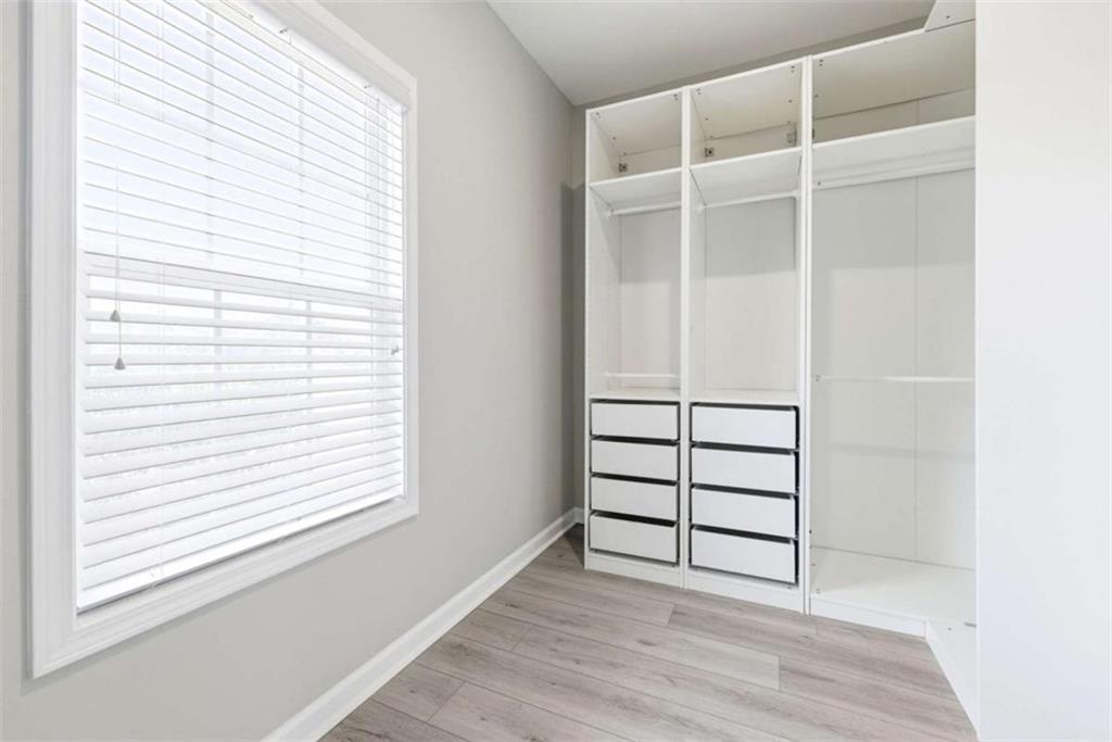 2066 Highway 63 Homer, GA 30547 - Photo 25 of 65 an empty room with wooden floor and windows
