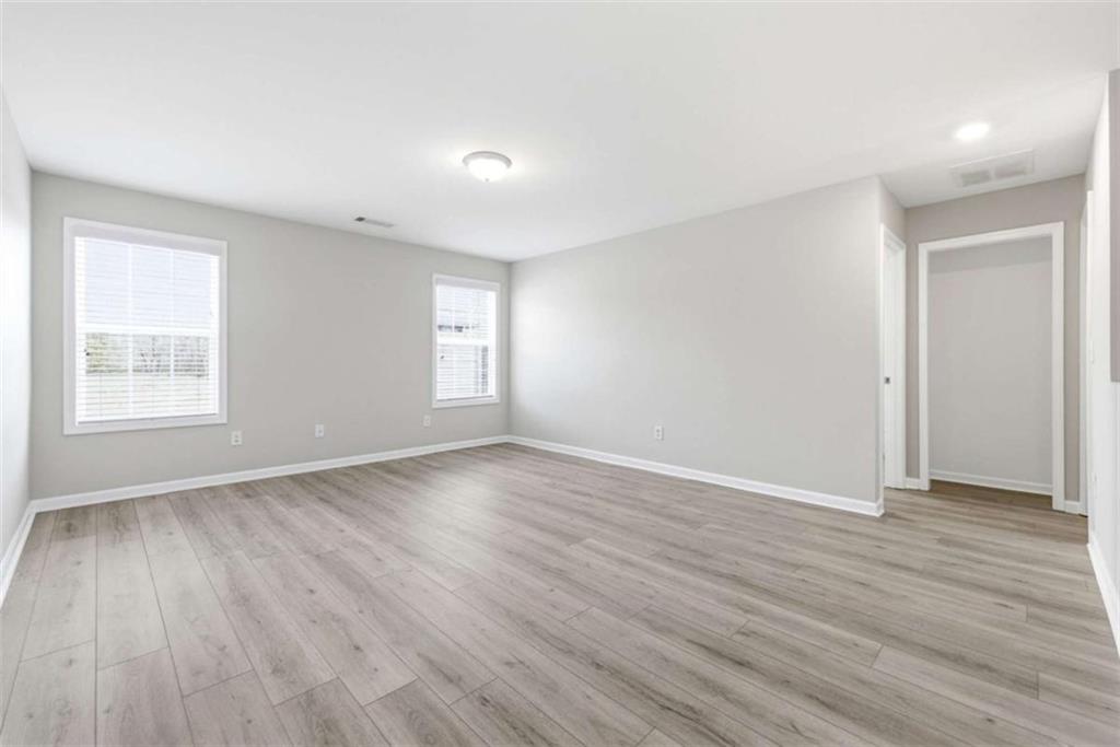 2066 Highway 63 Homer, GA 30547 - Photo 28 of 65 a view of an empty room with wooden floor and a window