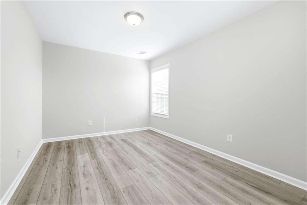 2066 Highway 63 Homer, GA 30547 - Photo 30 of 65 an empty room with wooden floor and windows