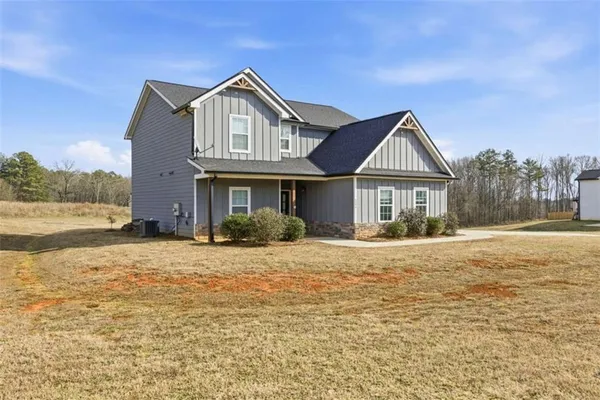 a front view of a house with a yard
