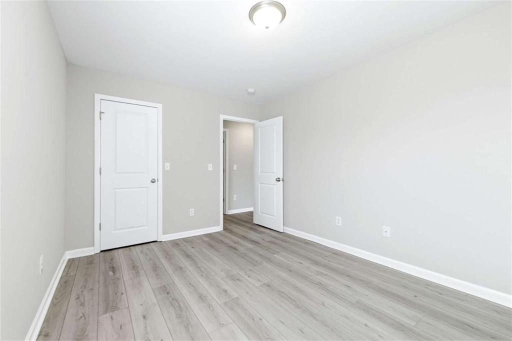 2066 Highway 63 Homer, GA 30547 - Photo 31 of 65 a view of an empty room with wooden floor