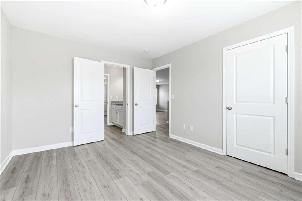 2066 Highway 63 Homer, GA 30547 - Photo 34 of 65 an empty room with wooden floor & closet area
