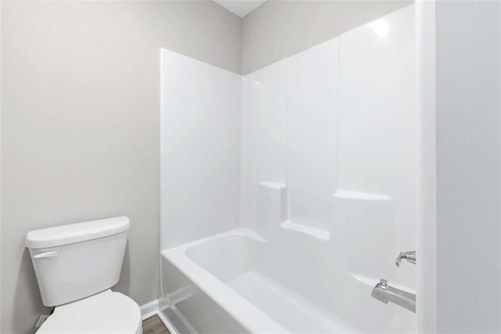 2066 Highway 63 Homer, GA 30547 - Photo 35 of 65 a white toilet sitting next to a bath tub