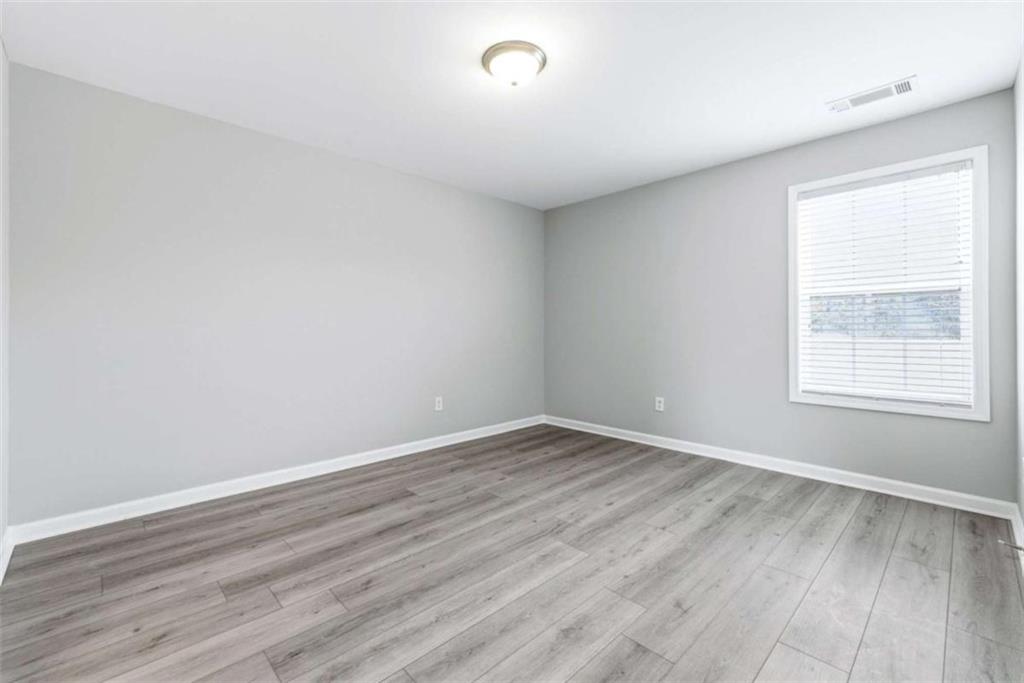 2066 Highway 63 Homer, GA 30547 - Photo 37 of 65 wooden floor in an empty room with a window