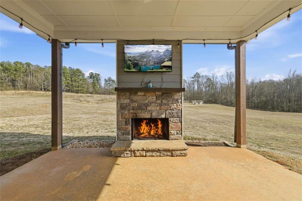 2066 Highway 63 Homer, GA 30547 - Photo 41 of 65 a living room with fireplace furniture and a flat screen tv