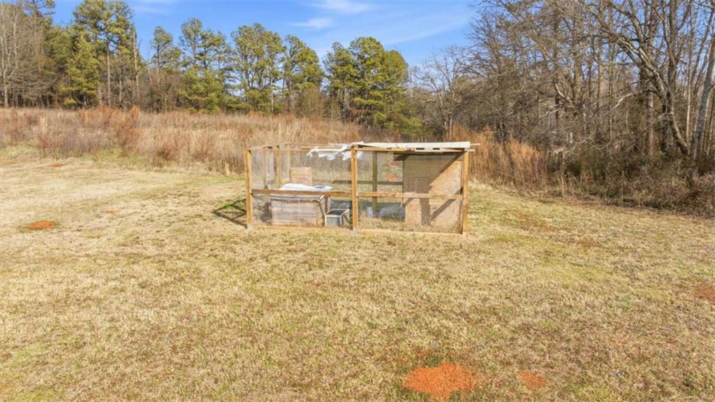 2066 Highway 63 Homer, GA 30547 - Photo 47 of 65 a backyard of a house with table and chairs