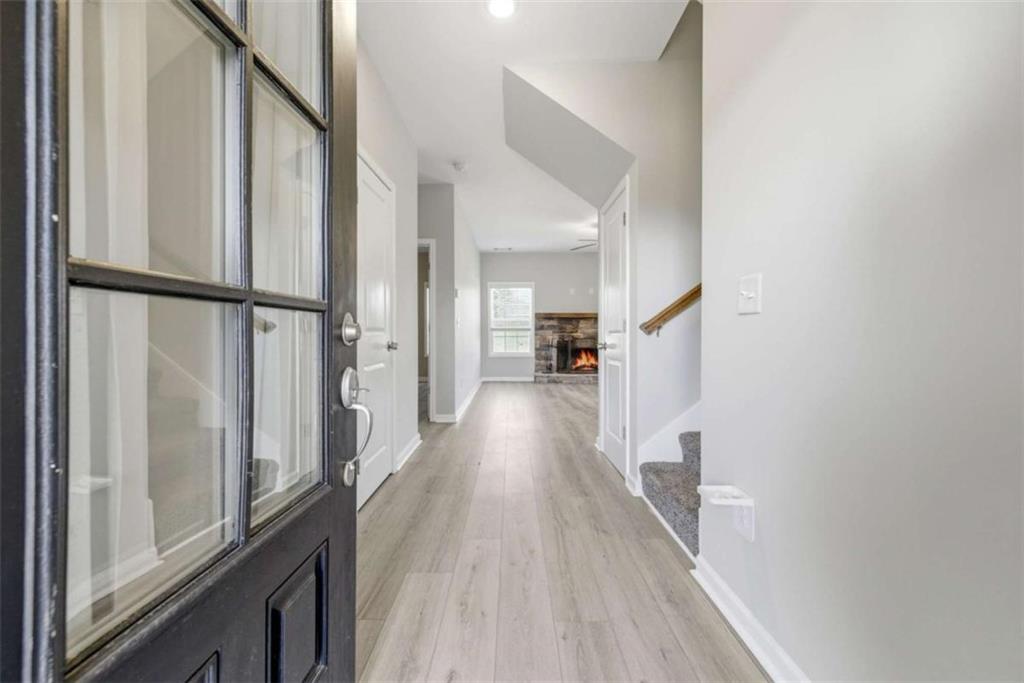 2066 Highway 63 Homer, GA 30547 - Photo 8 of 65 a view of a hallway with wooden floor and staircase