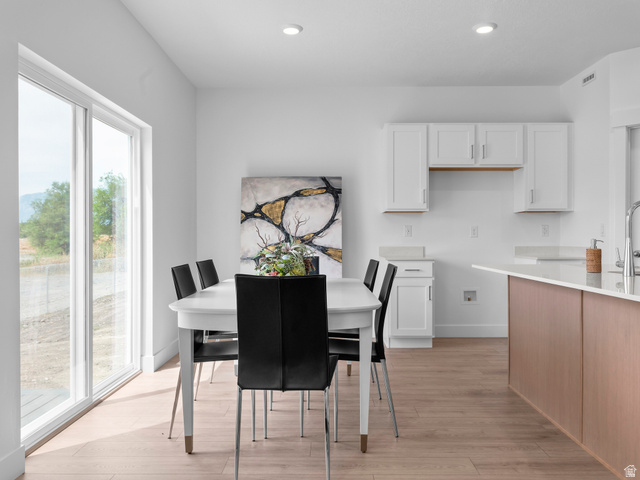 738 West 2840 South, Unit 6 Nibley, UT 84321 - Photo 11 of 23 Bright interior featuring a spacious dining area with wood-finish flooring