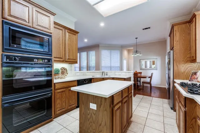 a kitchen with a stove and a microwave