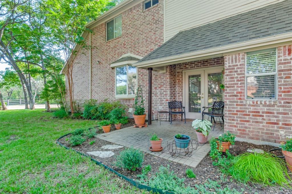 3400 Springbranch Drive Richardson, TX 75082 - Photo 17 of 37 front view of a house with a patio