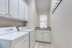 3400 Springbranch Drive Richardson, TX 75082 - Photo 32 of 37 a utility room with dryer and washer