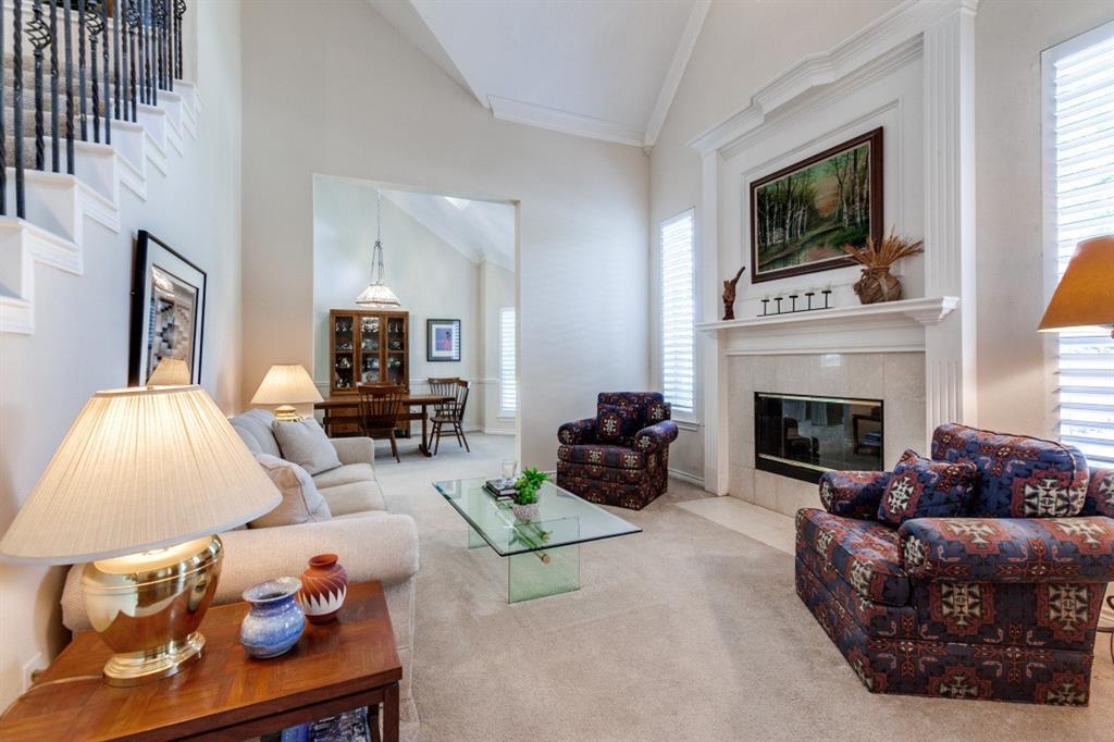 3400 Springbranch Drive Richardson, TX 75082 - Photo 5 of 37 a living room with furniture fireplace and flat screen tv
