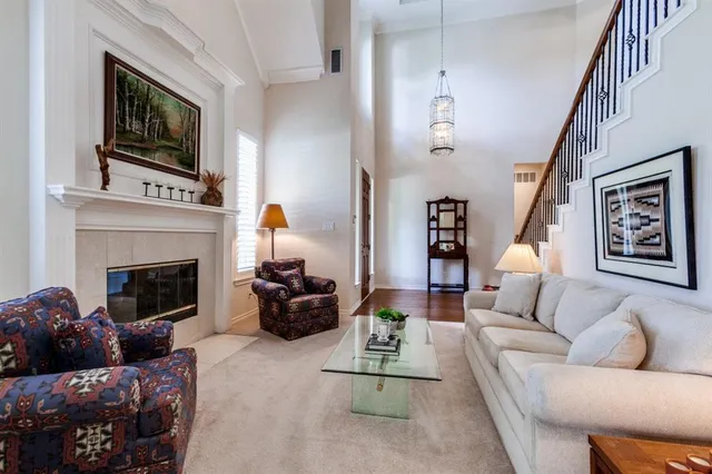 a living room with furniture fireplace and flat screen tv