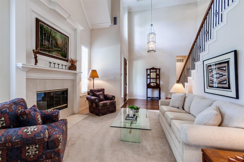 3400 Springbranch Drive Richardson, TX 75082 - Photo 6 of 37 a living room with furniture fireplace and flat screen tv