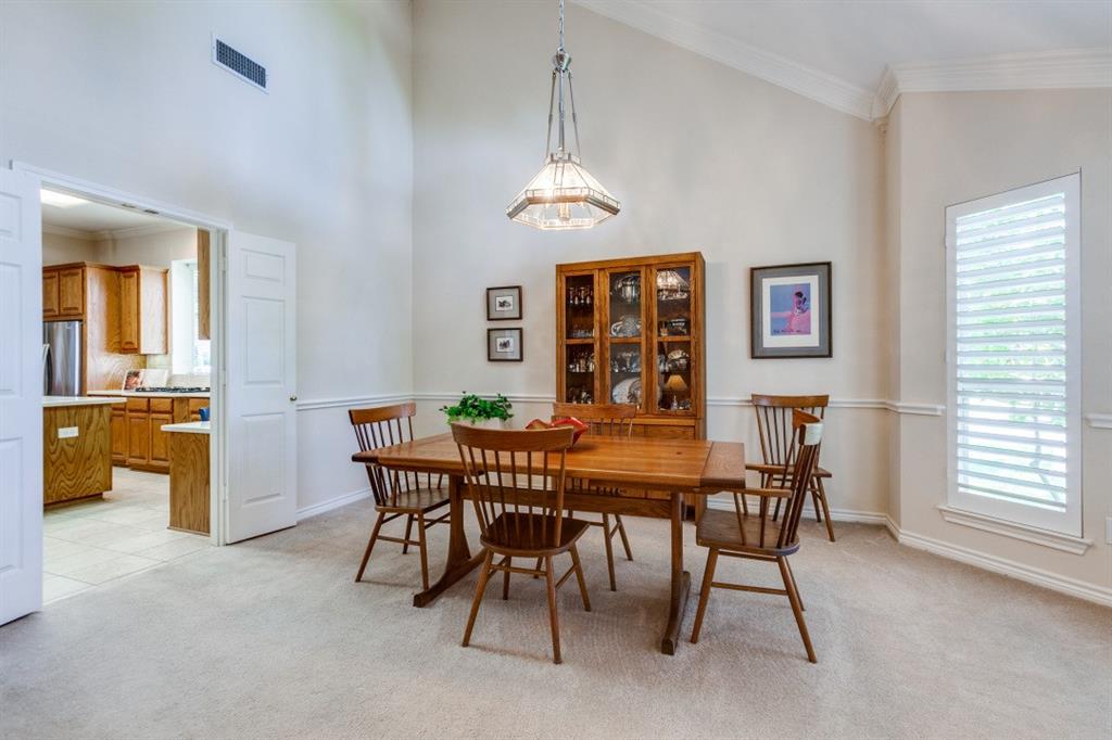 3400 Springbranch Drive Richardson, TX 75082 - Photo 7 of 37 a view of a dining room with furniture window and wooden floor
