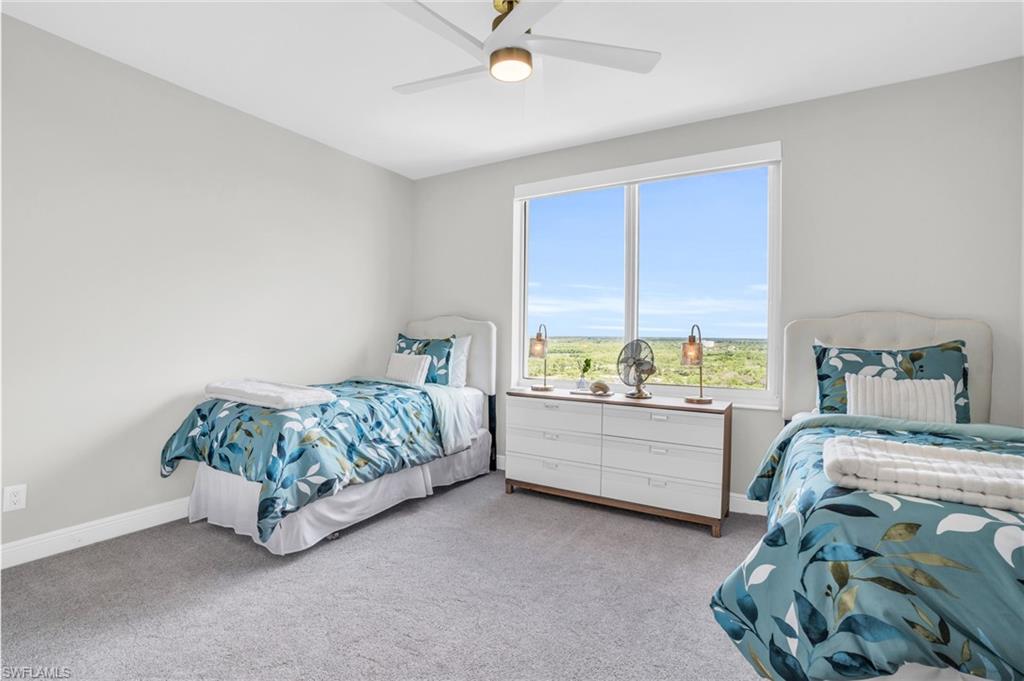 265 Indies Way, Unit 1404 Naples, FL 34110 - Photo 20 of 42 a bedroom with a bed and a window
