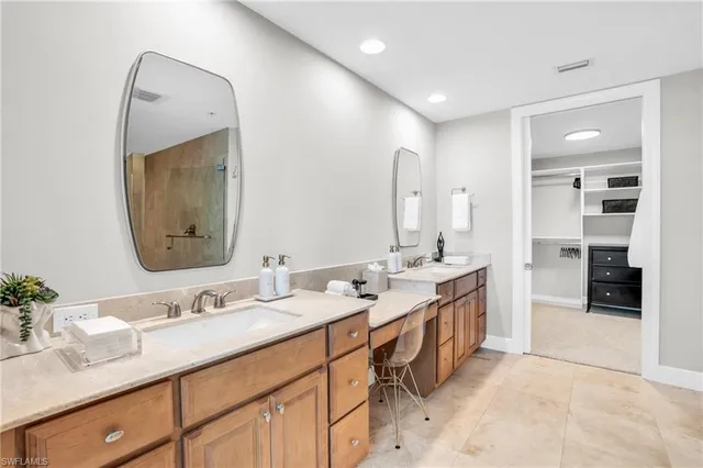 a spacious bathroom with a double vanity sink double and mirror