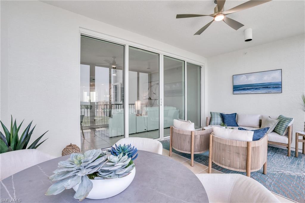 265 Indies Way, Unit 1404 Naples, FL 34110 - Photo 33 of 43 a living room with furniture and a potted plant