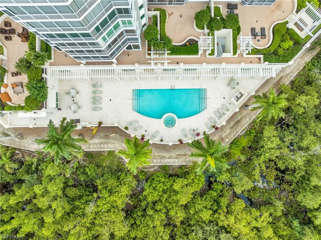 265 Indies Way, Unit 1404 Naples, FL 34110 - Photo 37 of 42 an aerial view of residential house with outdoor space and swimming pool