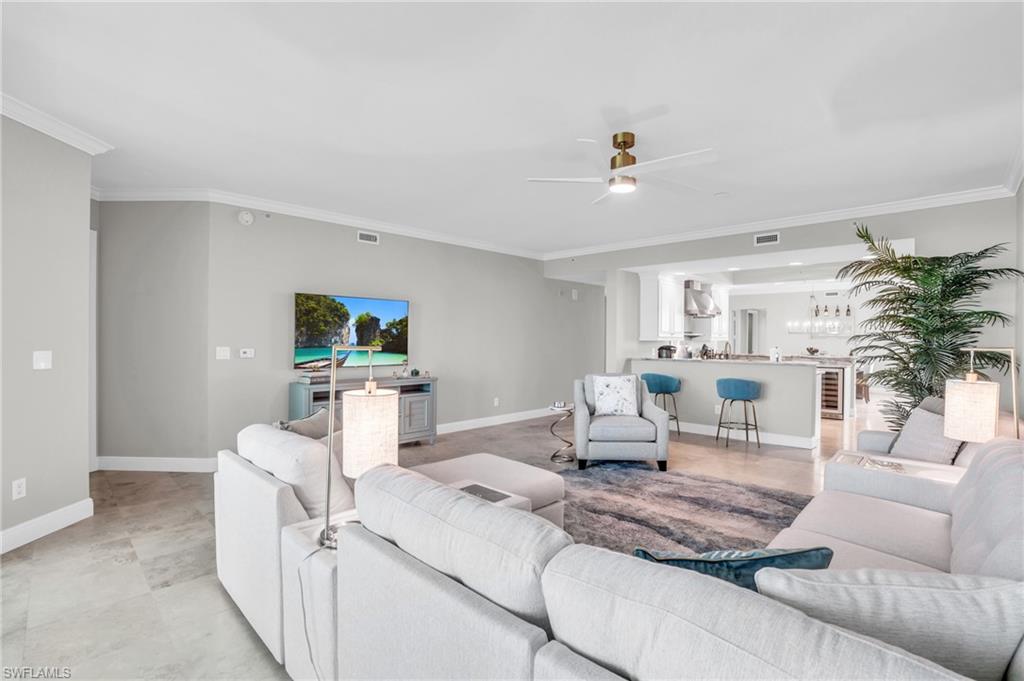 265 Indies Way, Unit 1404 Naples, FL 34110 - Photo 5 of 42 a living room with furniture