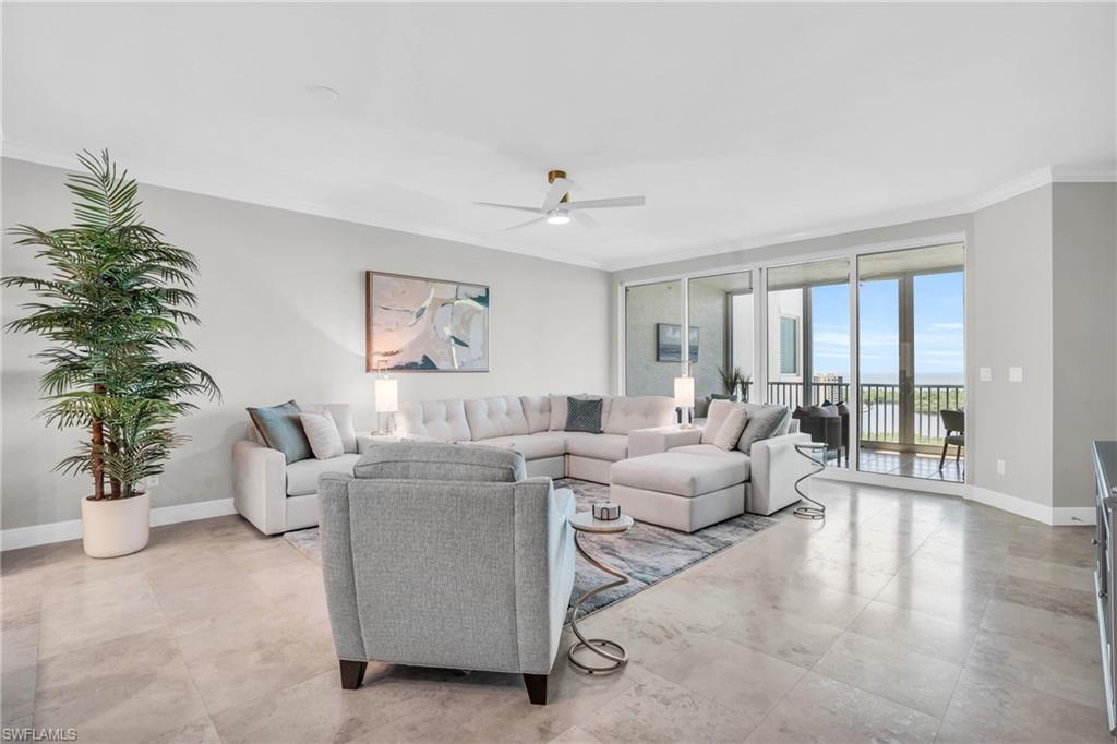 265 Indies Way, Unit 1404 Naples, FL 34110 - Photo 10 of 42 a living room with furniture potted plant and a window