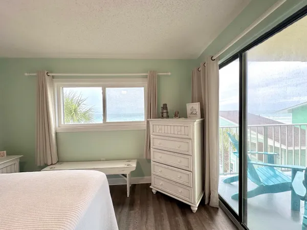 a bedroom with a bed and a night stand