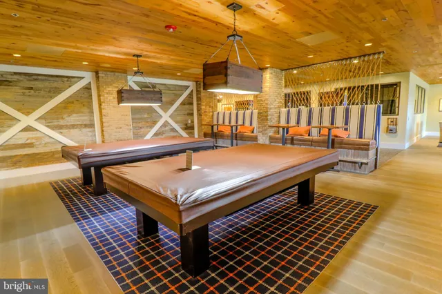 a living room with furniture and entry gate