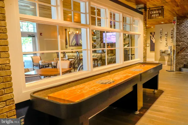 a close view of a fireplace with a clock on top