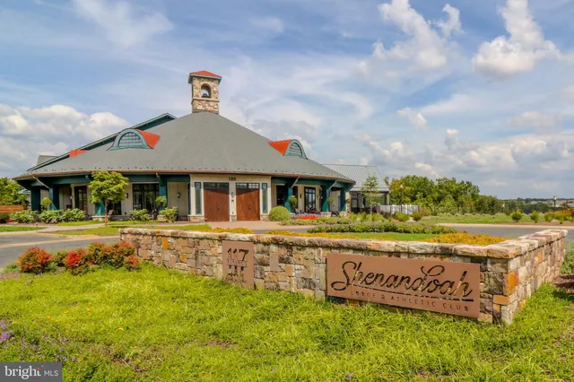 a kitchen with stainless steel appliances granite countertop a sink a oven and a large window