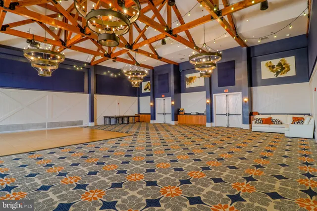 a view of a livingroom with furniture and hardwood floor