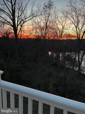 a view of a lake with houses in the back