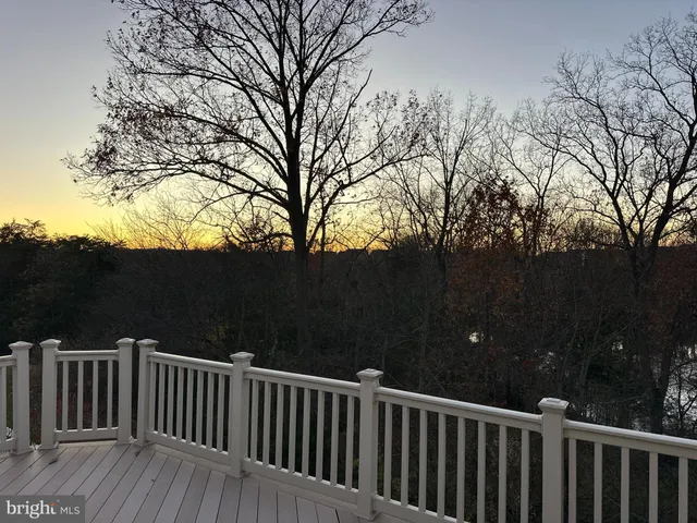 a view of a chairs on wooden deck