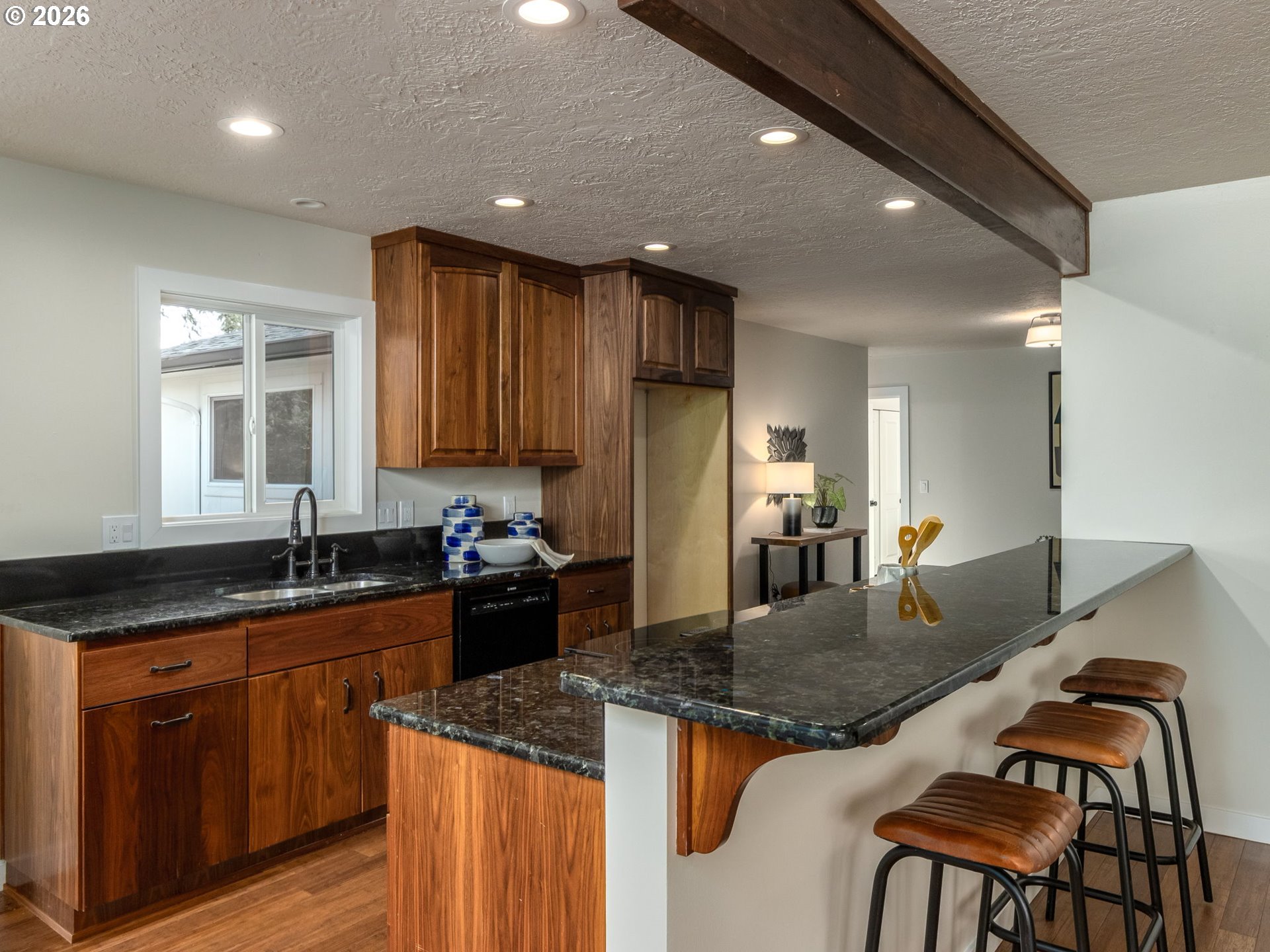 850 Northeast 179th Avenue Portland, OR 97230 - Photo 13 of 30 a kitchen with granite countertop kitchen island stainless steel appliances a sink stove and cabinets