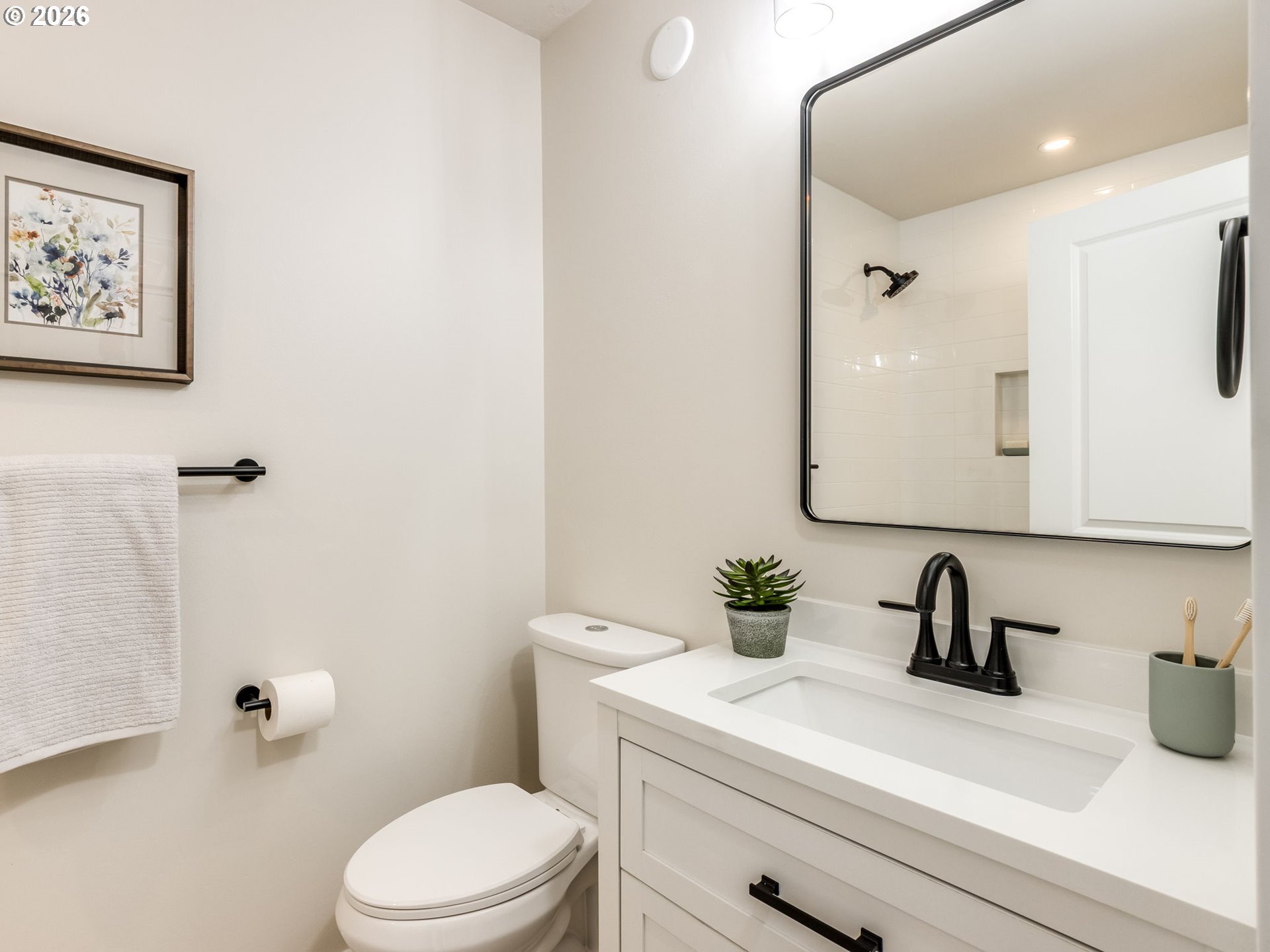 850 Northeast 179th Avenue Portland, OR 97230 - Photo 21 of 30 a bathroom with a sink a toilet and a mirror