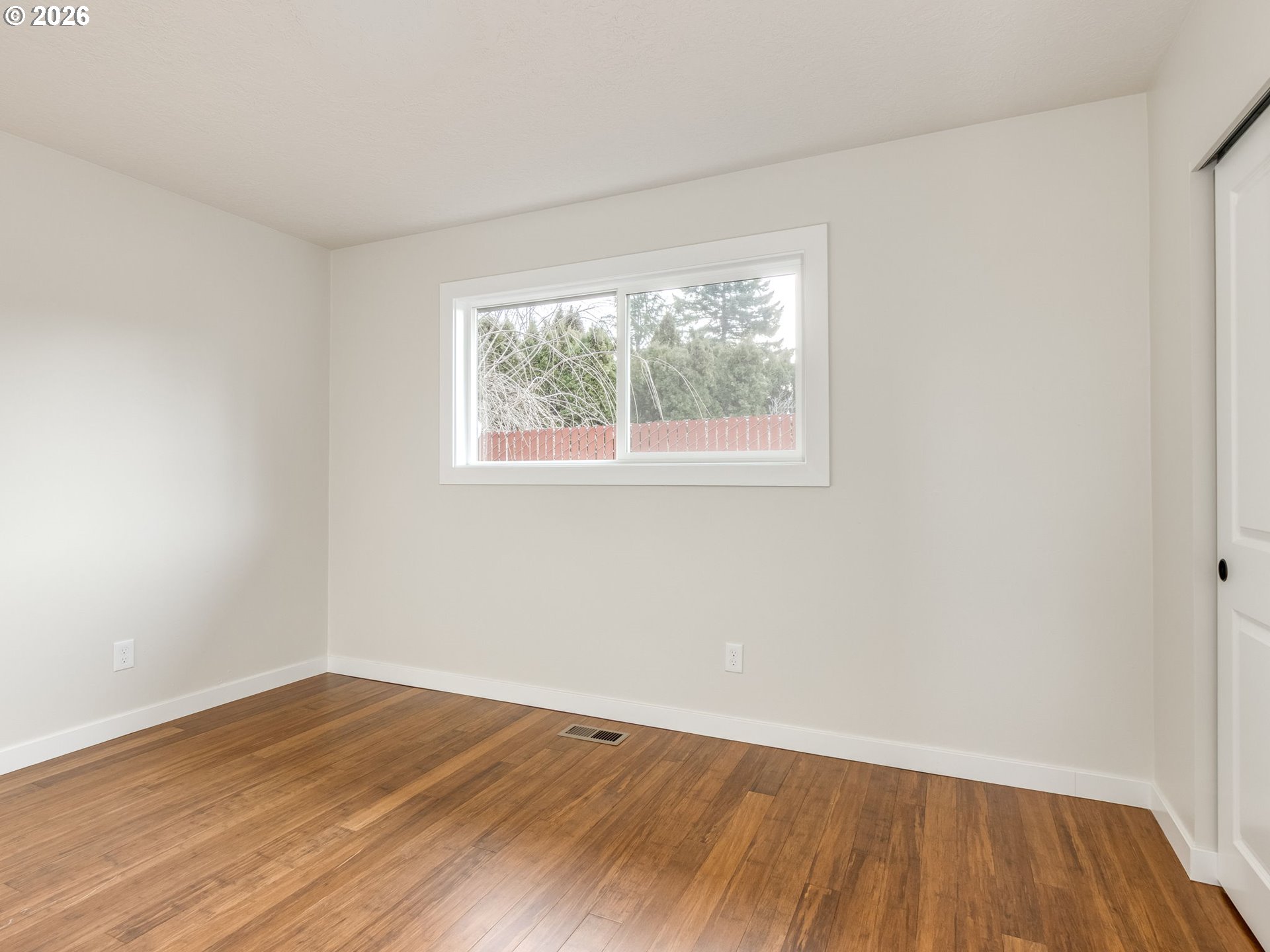 850 Northeast 179th Avenue Portland, OR 97230 - Photo 22 of 30 an empty room with wooden floor and windows